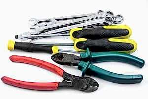 Toolsfor removing a stuck tap handle, including pliers, screwdrivers, wrenches, and wire cutters.