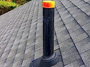 Plumbing vent on a roof, a potential hidden cause of a smelly drain in residential properties.